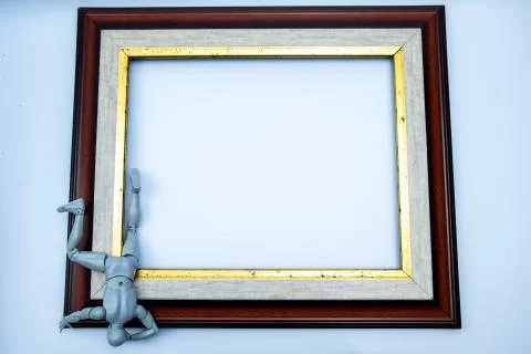 Mini figure try to escape from the frame, comfort zone concept Stock Photos