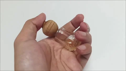 Mini Glass Car Diffuser Bottle with Wooden Cap Video stock 336888701