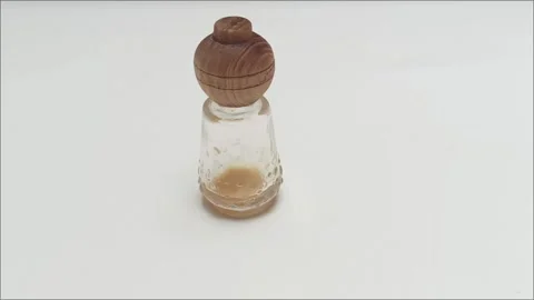 Mini Glass Car Diffuser Bottle with Wooden Cap Stock Footage 336888715