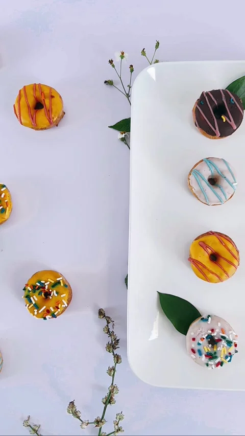 Mini glazed donuts on a white plate Stock Footage 303867533