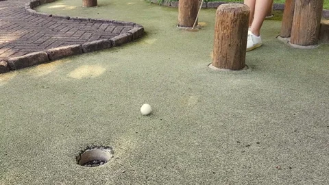 Mini golf equipment on artificial green grass Stock Footage 140244971