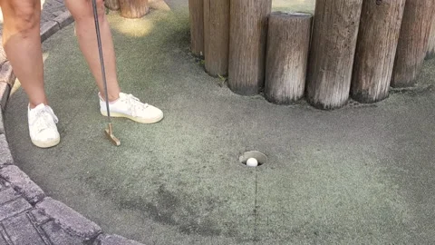 Mini golf equipment on artificial green grass Stock Footage 140245074