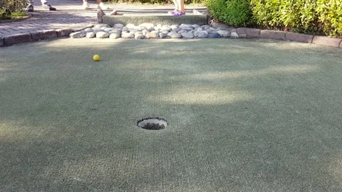 Mini golf equipment on artificial green grass Stock Footage 140245248