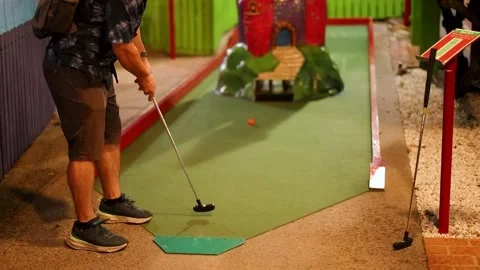 Mini Golf Putt Attempt in Indoor Course Stock Footage 304956594