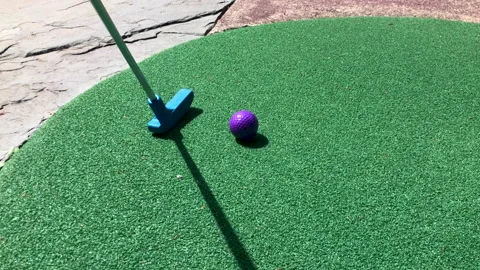Mini golf putting Stock Footage 205713837