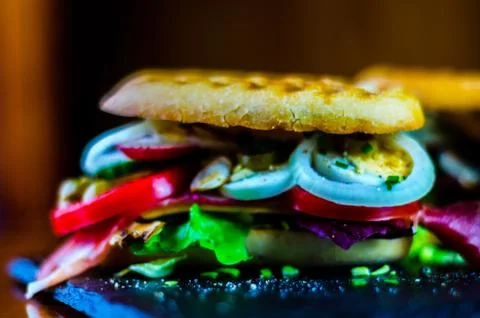 Mini grilled sandwich with various cold meats, cheese, mushrooms, tomato Stock Photos