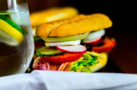 Mini grilled sandwich with various cold meats, cheese, mushrooms, tomato Stock Photos