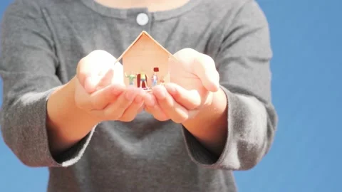 Mini house in hand Stock Footage 141837654