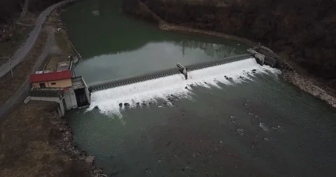 Mini hydroelectric station on the river dam water mountains Stock Footage 127026052