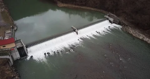 Mini hydroelectric station on the river dam water mountains Stock Footage 127026166