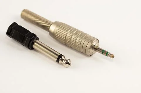 Mini-jack connector with adapter on a white background Stock Photos