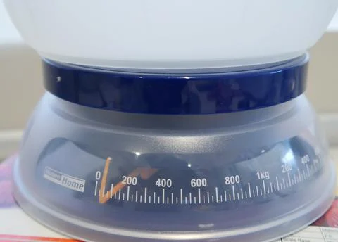 Mini kitchen weighing scale for precise measurement Stock Photos