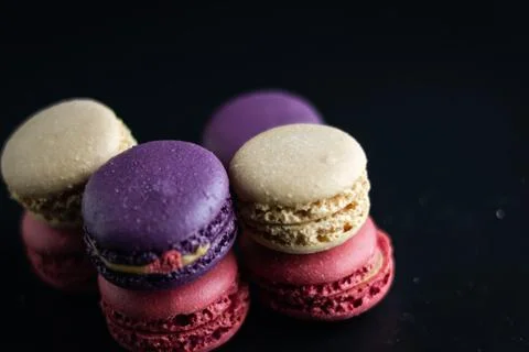 Mini macaron different colour in a dark background Foto stock