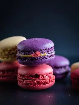 Mini macaron different colour in a dark background Foto stock