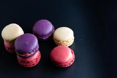 Mini macaron different colour in a dark background Foto stock