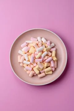 Mini marshmallows in white, pink, and pastel colors. Marshmallows as a food.. Stock Photos