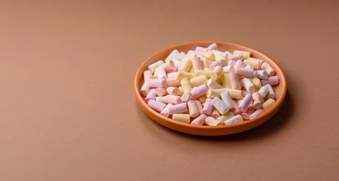 Mini marshmallows in white, pink, and pastel colors. Marshmallows as a food.. Stock Photos