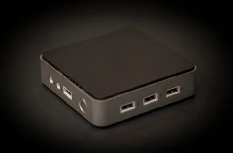 A mini PC with black background Photos