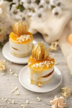 Mini peach cake on a wooden background Stock Photos