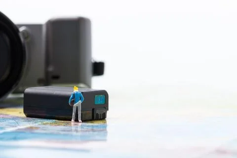 Mini people model checking digital camera for travel Stock Photos