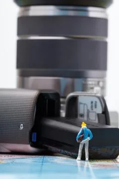 Mini people model checking digital camera for travel Stock Photos