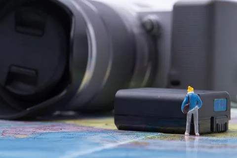 Mini people model checking digital camera for travel Stock Photos