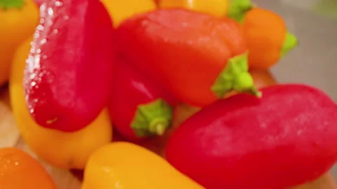 Mini Peppers Pull Back Above on Cutting Board Macro Stock Footage 156054123