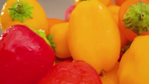 Mini Peppers Push Forward Above Angle on Cutting Board Macro Video stock 156055401