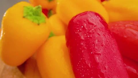 Mini Peppers Push Forward Above on Cutting Board Macro Stock Footage 156055831