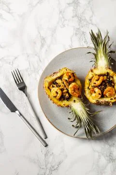 Mini pineapple fried black rice with shrimps Stock Photos