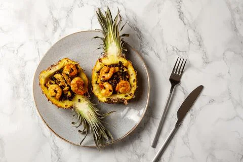 Mini pineapple fried black rice with shrimps Stock Photos