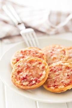 Mini pizza on plate Stock Photos