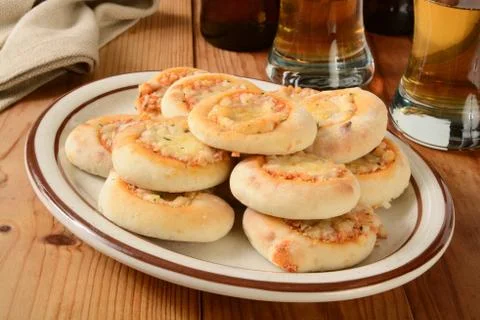 Mini pizzas and beer Stock Photos