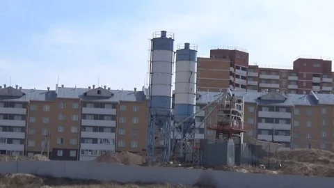 Mini plant for the production of concrete on the background of houses under cons Stock Footage 75562789