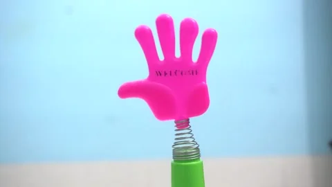 Mini plastic hand clap toy candy combines playful Stock Footage 336179718