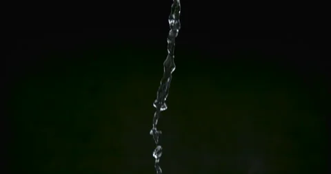 Mini potatoes fall with water droplets on black background closeup in ultra slow Video stock 199461551