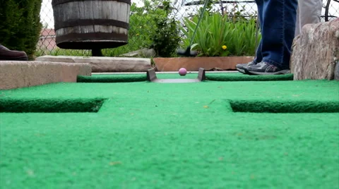 Mini putt golf ball by camera Stock Footage 5914590