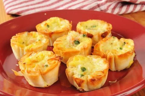 Mini quiche with bacon bits Stock Photos