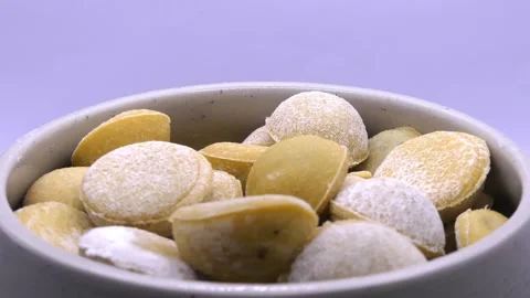 Mini ravioli in ramekin rotating on white background 스톡 동영상 342419266