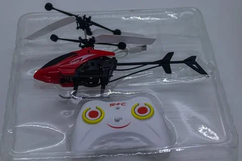 Mini Red RC Helicopter with Remote Control in Packaging Stock Photos