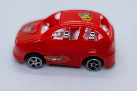 Mini Red Toy Car on Table Stock Photos