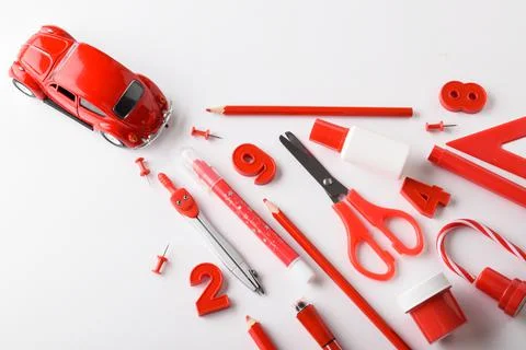 Mini red typewriter and a train of red stationery. Delivery, purchase, sale Foto stock
