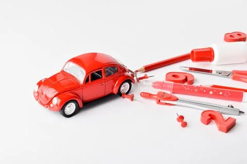 Mini red typewriter and a train of red stationery. Delivery, purchase, sale Photos