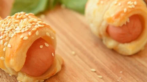 Mini sausage wrapped in puff pastry Video stock 70156015