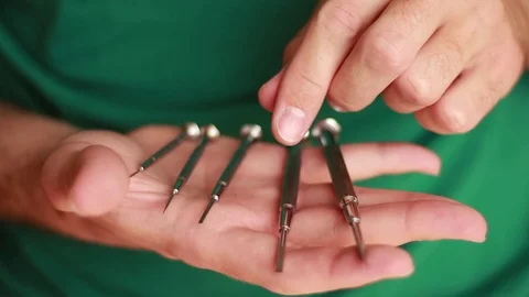 Mini screw-drivers in man's hand Vídeos de archivo 74291966