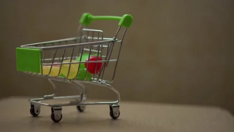 Mini shopping basket with sweets inside Stock Footage 153133324