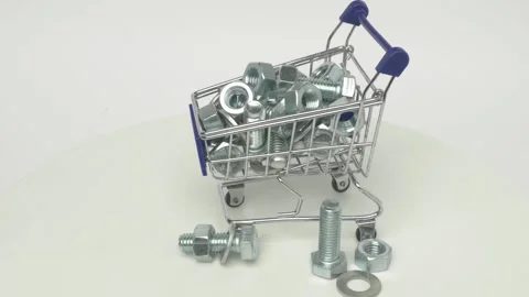 A Mini Shopping Cart That is Completely Filled with Various Metallic Fasteners Stock Footage 287826258