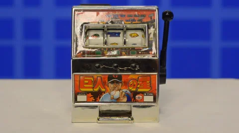 Mini slot machine started and stopped by hand. V.2 Stock Footage 39739954