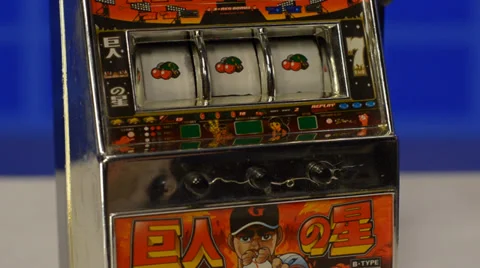 Mini slot machine started and stopped by hand Stock Footage 39740435