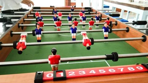 A mini soccer table with red and blue teams Stock Photos
